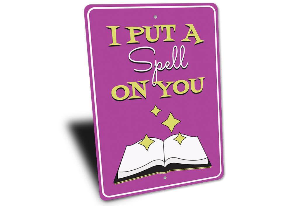 Purple "I Put a Spell on You" decorative metal sign with open book and stars Halloween wall art