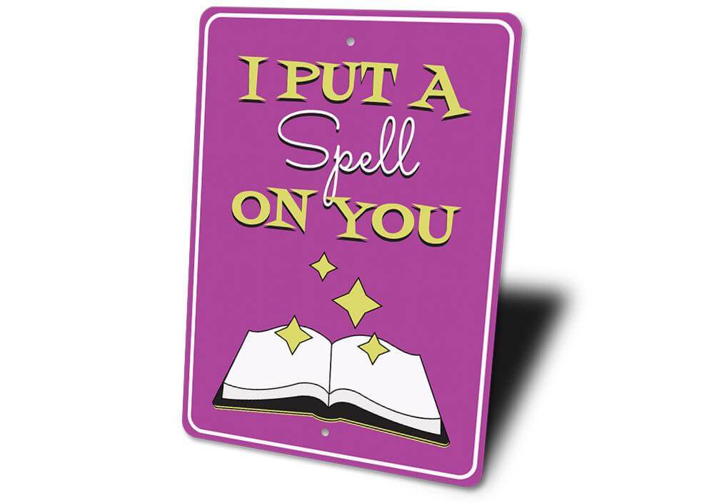 Purple metal "I Put a Spell on You" sign with an open book and sparkling stars, decorative Halloween wall accent