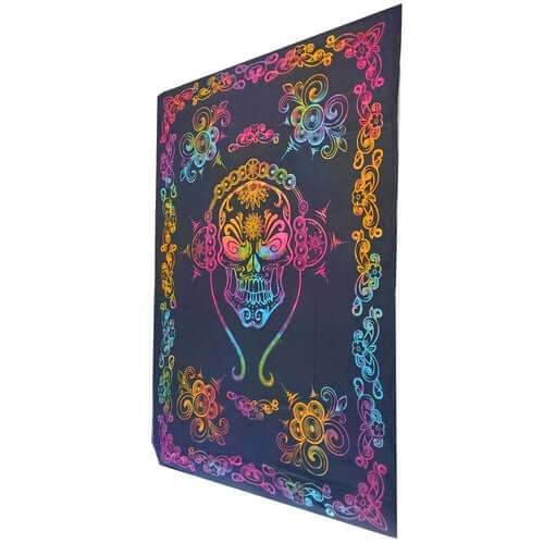Gothic skull tapestry with colorful tie dye skull and floral border on black cotton fabric
