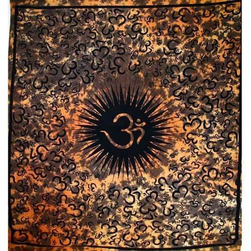 Saffron Om Echoes tapestry with central OM symbol and surrounding smaller OM designs in warm saffron tones, handmade cotton wall hanging.