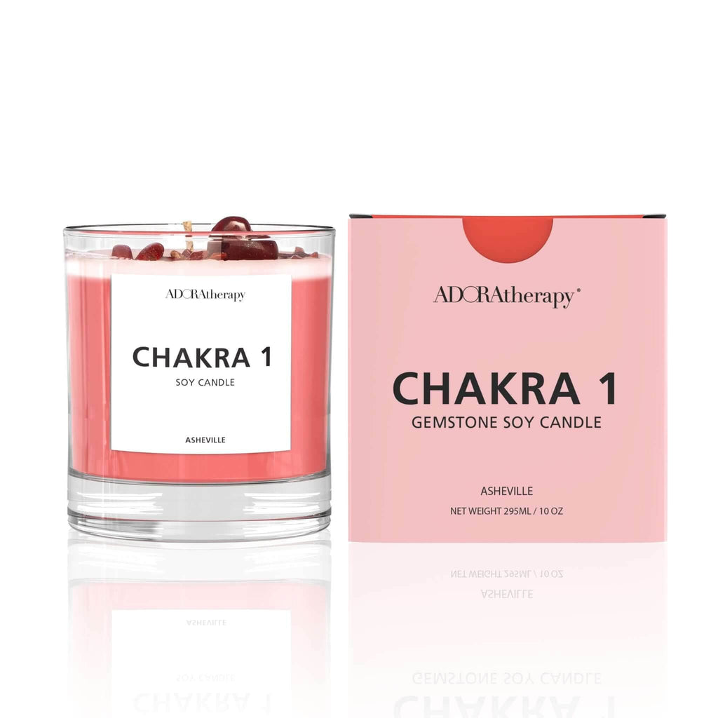 Chakra 1 Red Jasper gemstone soy candle with spicy, woody aroma in clear glass and pink packaging